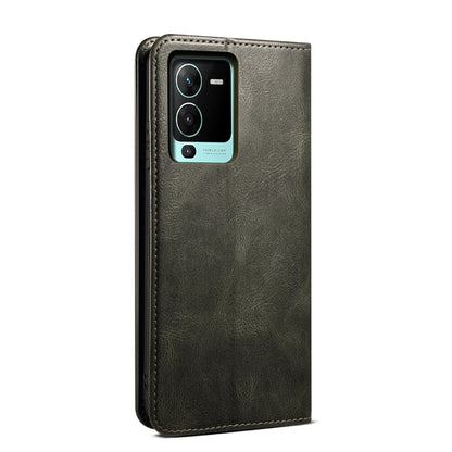 Dark green crazy horse leather phone case with camera cutout and textured finish.