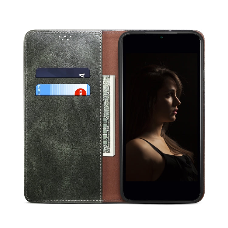 Dark green leather wallet phone case open view, showing card slots and snap clasp.