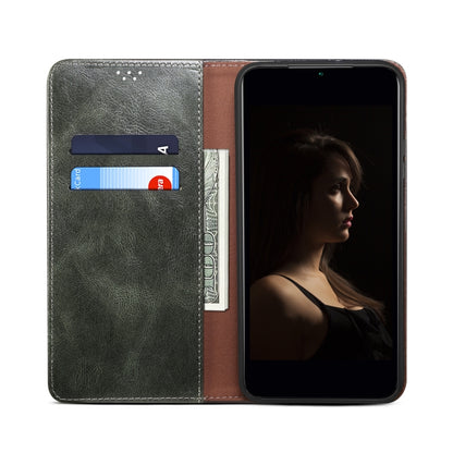 Dark green leather wallet phone case open view, showing card slots and snap clasp.