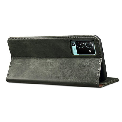 Dark green leather wallet phone case with fold-over cover and camera cutout.