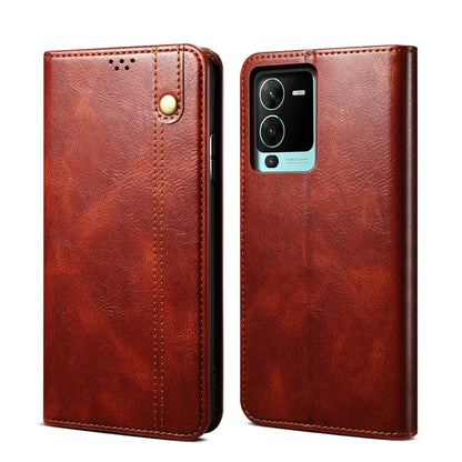 Brown crazy horse leather phone case with snap button, stitched front, and camera cutout.