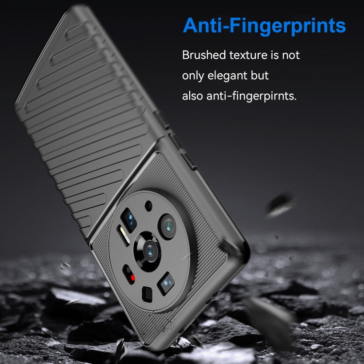 Black rugged TPU phone case with raised camera area and textured side grip