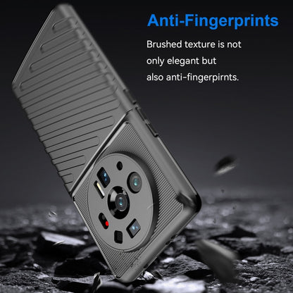 Black rugged TPU phone case with raised camera area and textured side grip