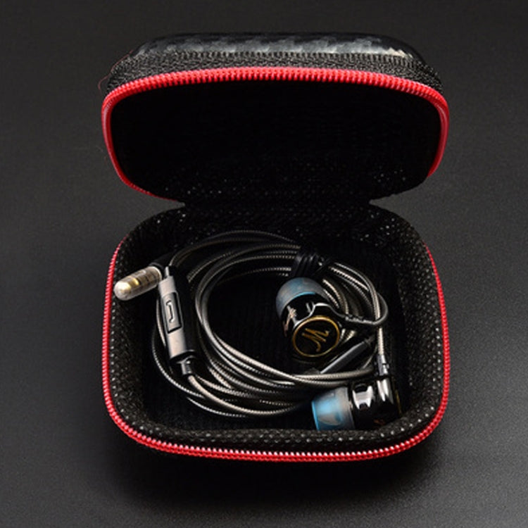 Open headphone storage case holding neatly coiled cables; black lining with red trim.