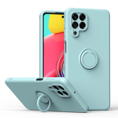 Light cyan silicone phone case with ring kickstand and camera cutouts, protective cover