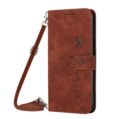 Brown leather folio phone case with heart pattern and lanyard strap