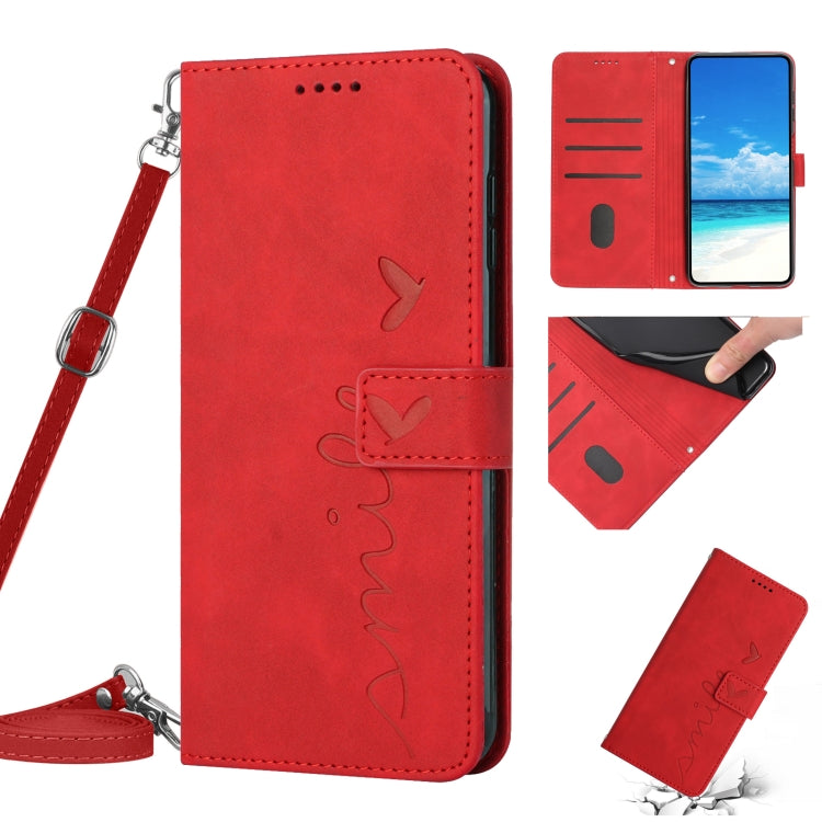 Red leather phone case with heart pattern and lanyard strap