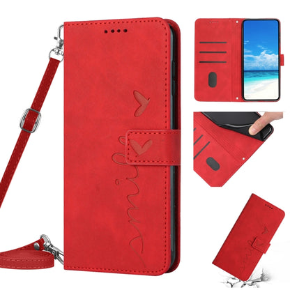 Red leather wallet phone case with heart pattern stitching and wrist lanyard strap