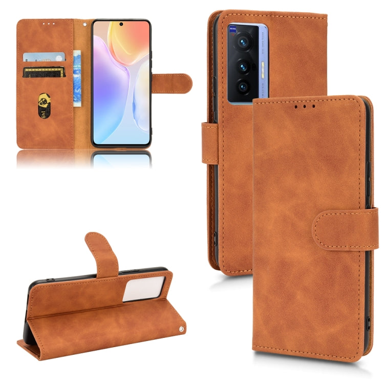 Brown magnetic flip leather phone case with card slots and fold-over front cover