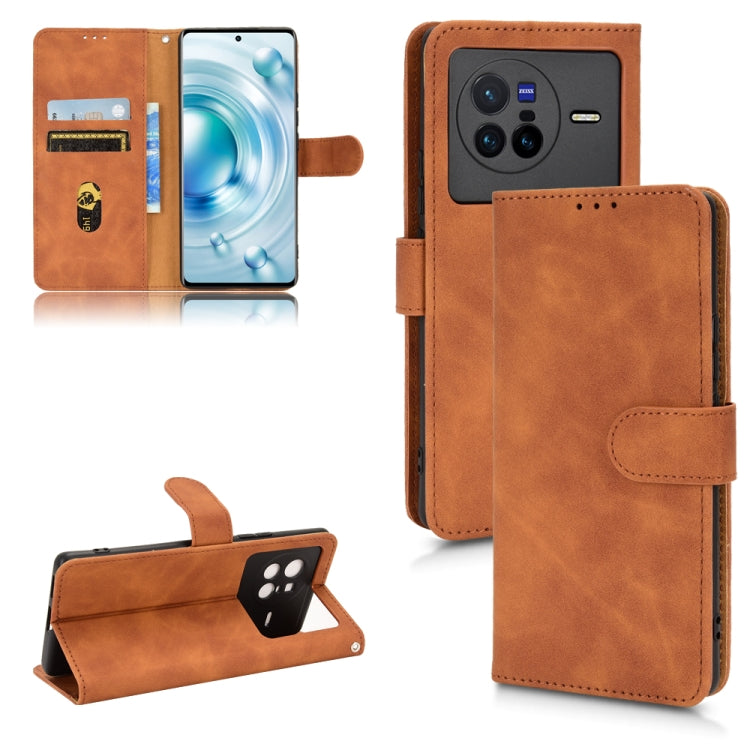 Tan/brown magnetic flip leather phone case with card slots and hinged cover