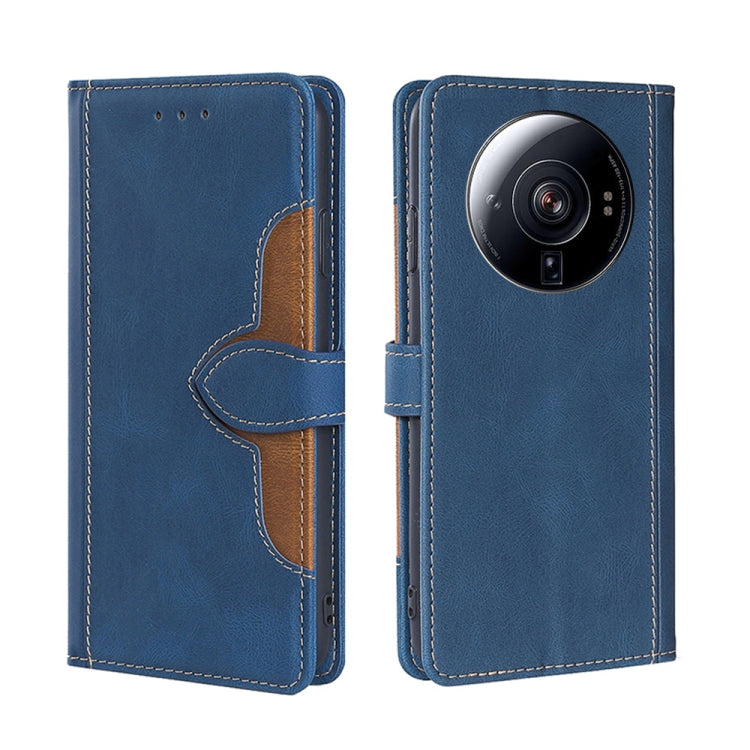 Blue leather phone case with magnetic buckle, camera lens cutout, tan accent stitching.