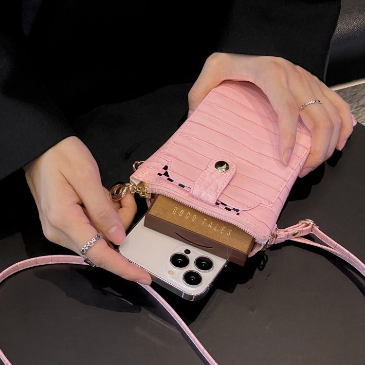 Pink faux-croc zip card holder mobile phone bag with hands holding the open case