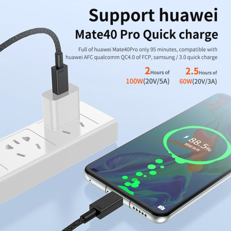 Braided USB-C charging cable connected to a phone and power adapter, black plugs