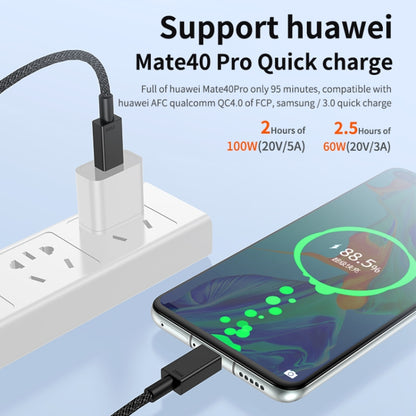 Braided USB-C charging cable connected to a phone and power adapter, black plugs