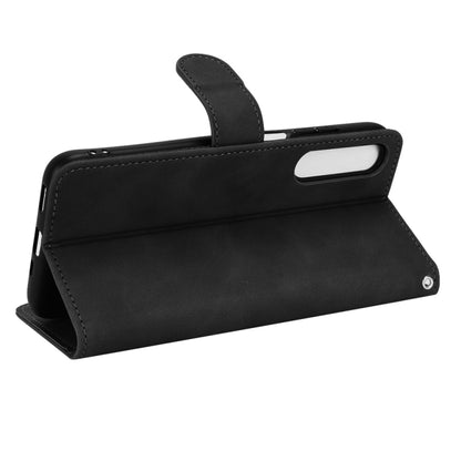 Black magnetic flip leather phone case with folio stand and side opening cutouts