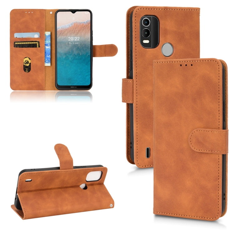 Tan leather flip phone case with magnetic closure and card slots