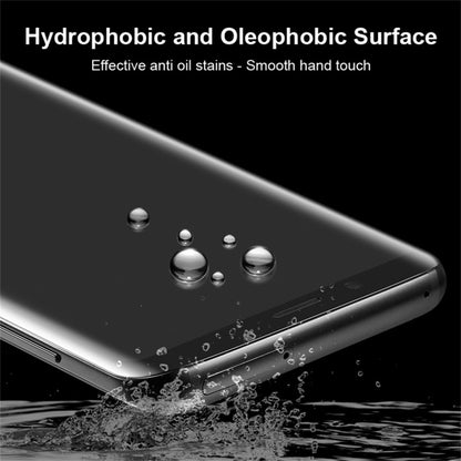 Tempered glass screen protector with water droplets on smartphone screen surface