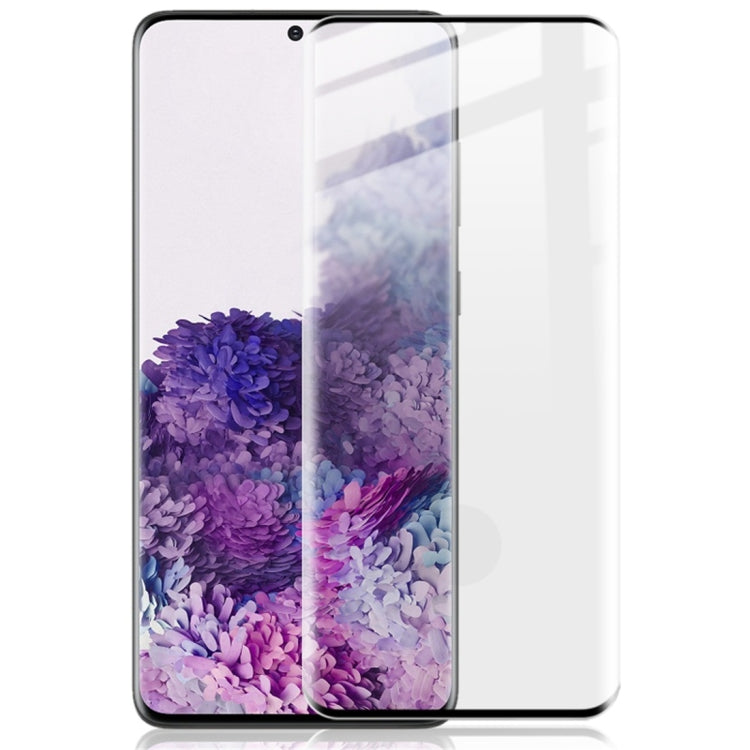 Tempered glass screen protector film on smartphone display with purple flower wallpaper