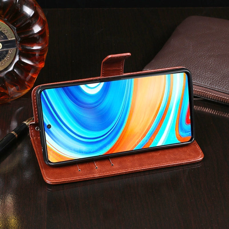 Brown folio-style flip leather phone case with magnetic strap, front cover open
