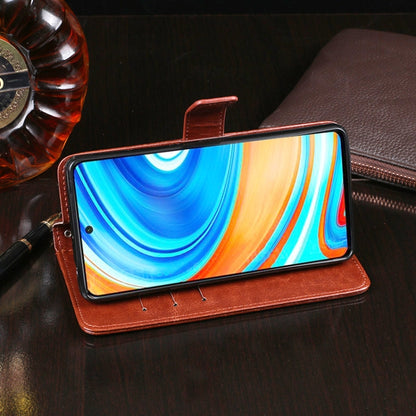 Brown folio-style flip leather phone case with magnetic strap, front cover open