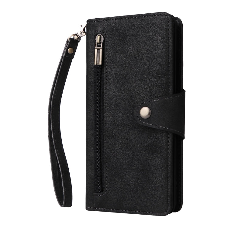 Black leather phone case with card compartment, snap tab, and wrist strap