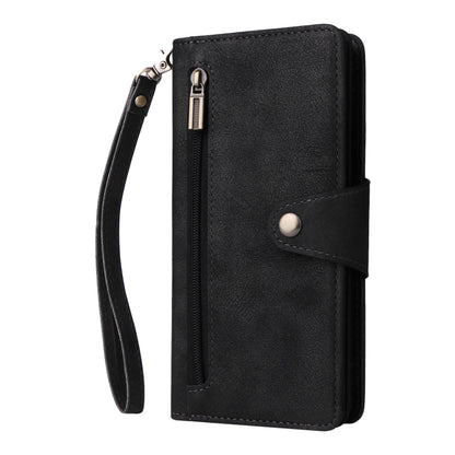 Black leather phone case with card compartment, snap tab, and wrist strap