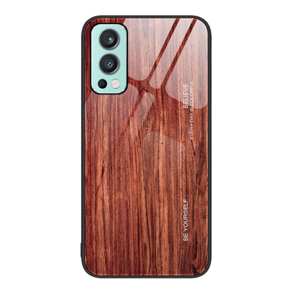 Wood grain glass phone case with dark red wood pattern, teal camera trim and black border