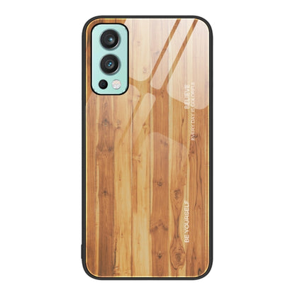 Wood grain glass phone case with light wood pattern, teal camera trim and black border