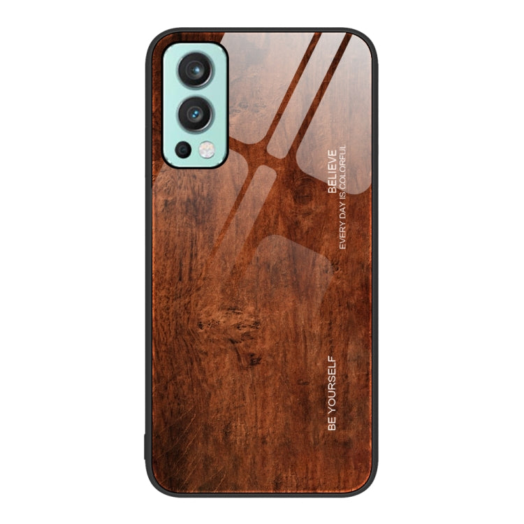 Wood grain glass phone case with dark brown wood pattern, teal camera trim and black border