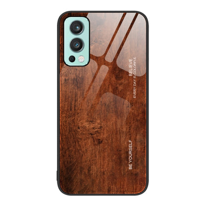 Wood grain glass phone case with dark brown wood pattern, teal camera trim and black border
