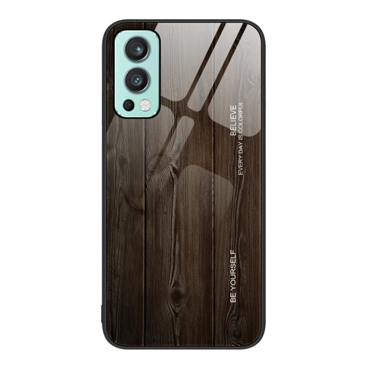Wood grain glass phone case with dark gray wood plank pattern, teal camera trim and black border