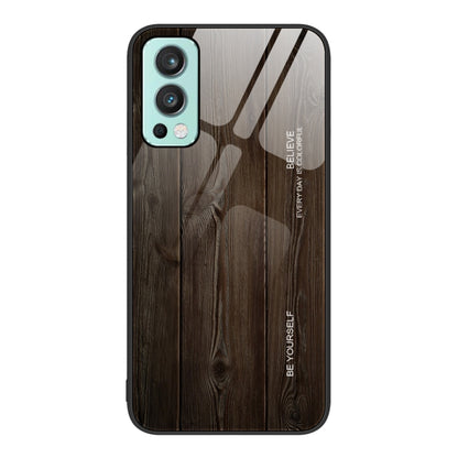 Wood grain glass phone case with dark gray wood plank pattern, teal camera trim and black border
