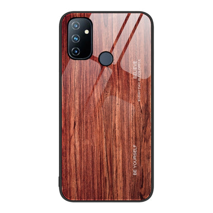 Wood grain glass phone case with deep red wood pattern, black camera module and round flash cutout