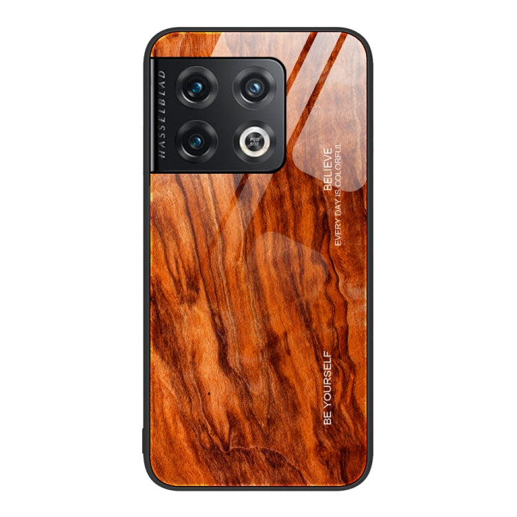 Wood grain glass phone case with camera cutouts and orange-brown swirled wood look