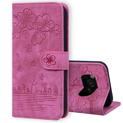 Rose pink folio phone case with embossed sakura cat pattern, flip cover and lens cutout