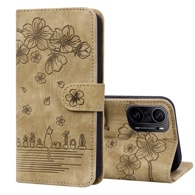 Beige embossed leather phone case with floral sakura cat design, opened view