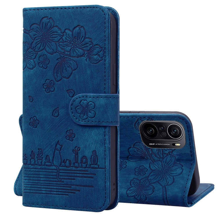 Royal blue embossed leather folio phone case with floral cat design, flip cover and stand