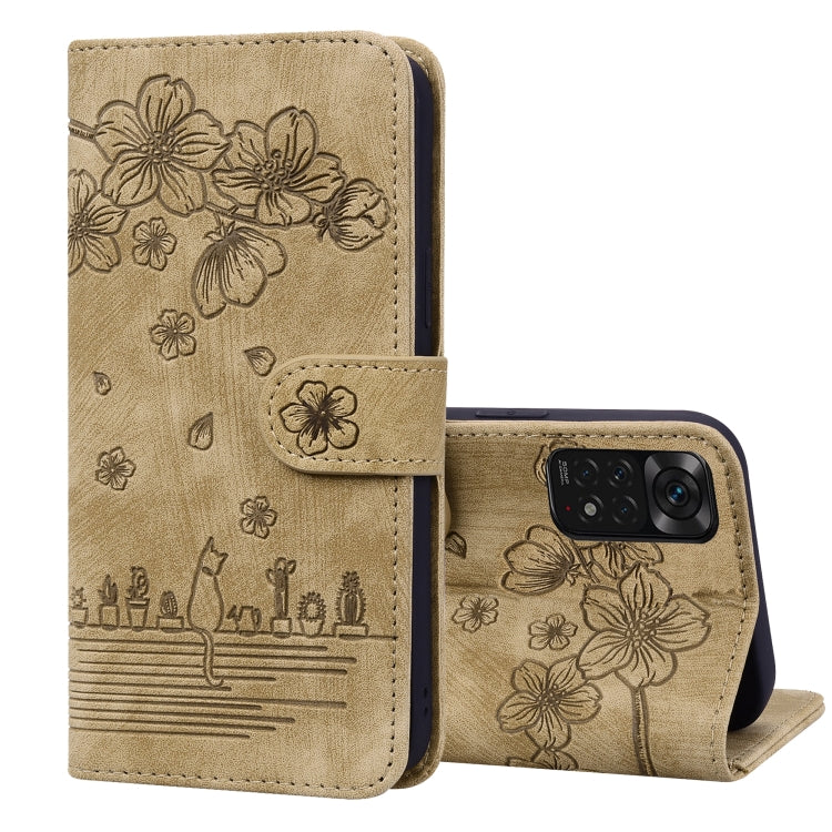 Beige folio phone case with embossed floral sakura cat design and camera window