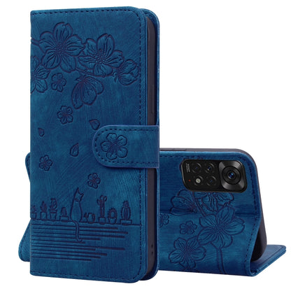 Royal blue folio phone case with embossed sakura cat pattern, flip cover and camera cutout