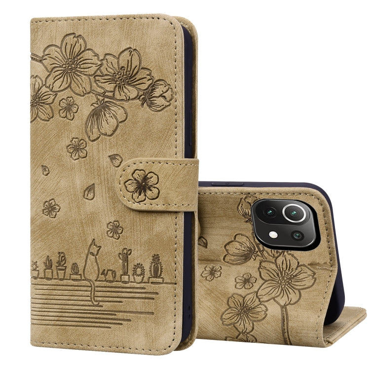 Brown embossed leather folio phone case with floral cat design, flip cover and stand