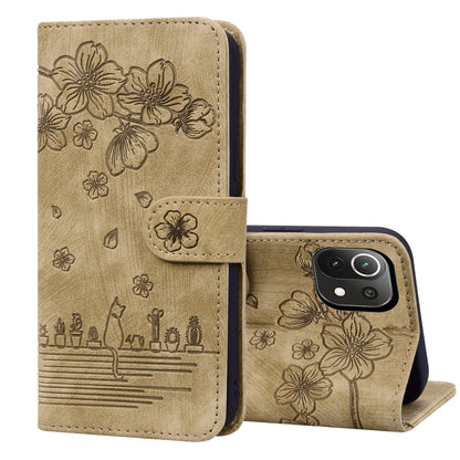 Brown embossed leather folio phone case with floral cat design, flip cover and stand