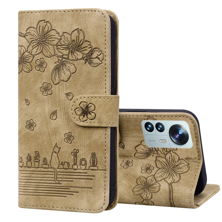 Brown embossed leather folio phone case with floral cat design, flip cover and stand