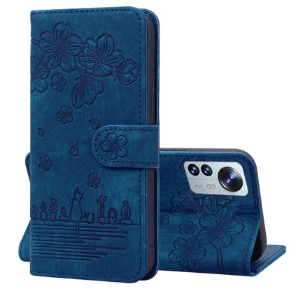Royal blue folio phone case with embossed sakura cat pattern, flip cover and camera window