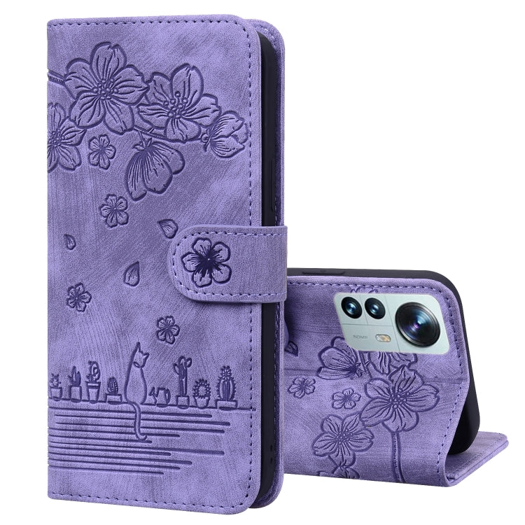 Lavender embossed floral flip phone case with strap tab and visible camera lens
