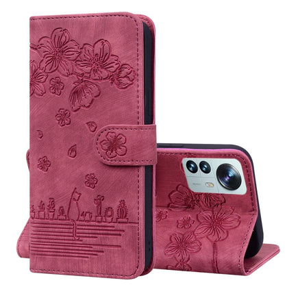 Rose pink faux leather wallet phone case with embossed sakura floral relief and camera opening