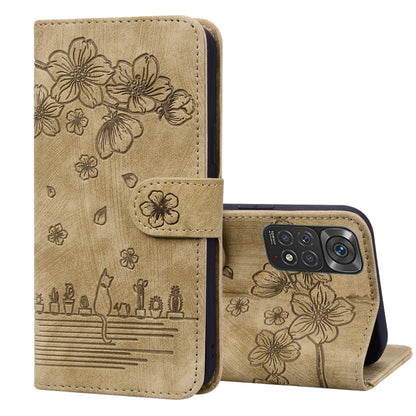 Brown embossed leather folio phone case with floral cat design, flip cover and stand