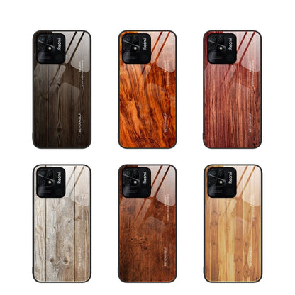 Set of wood grain glass phone cases in dark, orange, and light wood patterns