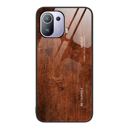 Wood grain glass protective phone case in reddish-brown with camera cutouts