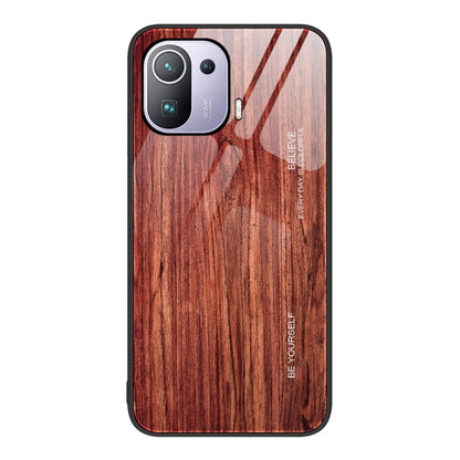 Dark red-brown wood-grain glass phone case with camera cutouts and raised rim