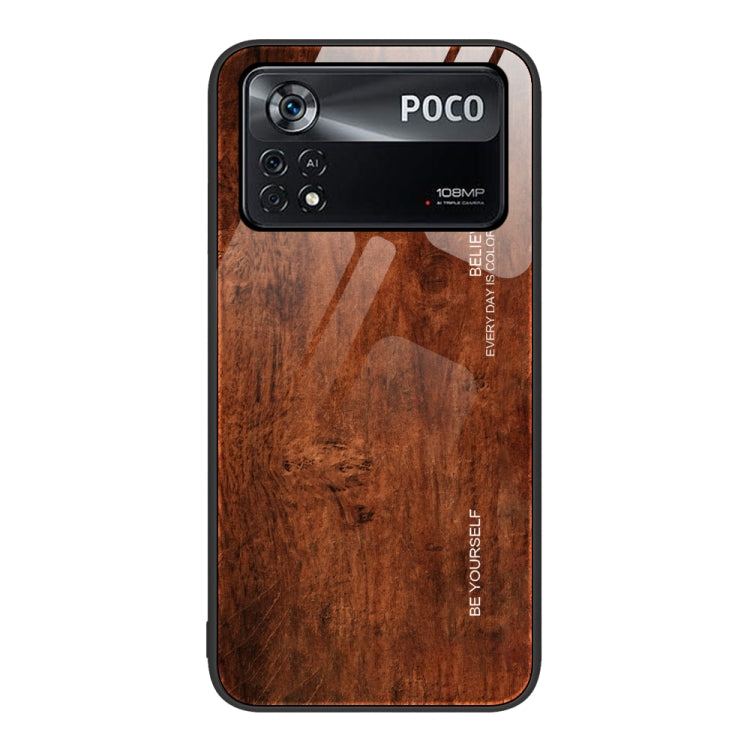 Brown wood-grain glass phone case with camera cutouts and protective lip edges